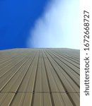 Perspective view of a wall composed of lines towards the sky. Reinforcing the concept of future vision and business planning.