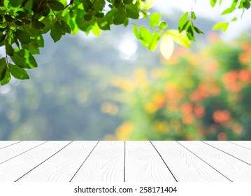 Perspective wood over blur trees with bokeh background, spring and summer season - Shutterstock ID 258171404