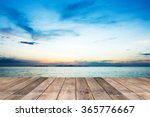 Perspective of wood terrace against beautiful seascape at sunset with free copy space use for background or backdrop.
