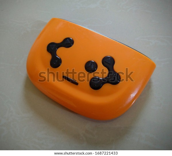 perspectives view of Pumpkin orange\
colour Children electric car bluetooth remote control\
.