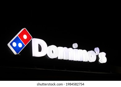 PERT, WA - JUNE 06 2021:Domino's Pizza Store Sign Illuminated Over Night Sky.Domino's, Is An American Multinational Pizza Restaurant Chain Founded In 1960.