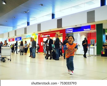 Perth, Australia - 6 September 2017 : A Little Girl Is Running Happily At The International Perth Airport.