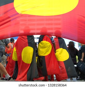 Perth, Australia, January 26th 2019: Australia Day Aboriginal Land Rights Protesters Wearing The Aboriginal Flag 