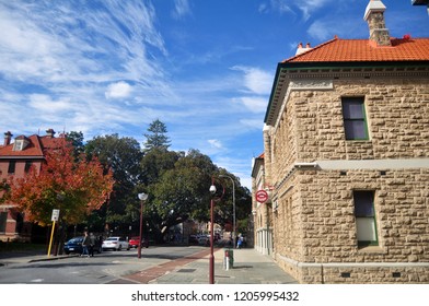 PERTH, AUSTRALIA - JUNE 3 : Australian People Walking On Pavement Beside Road With Classic Building Fire Station At Murray Street On June 3, 2016 In Perth, Australia