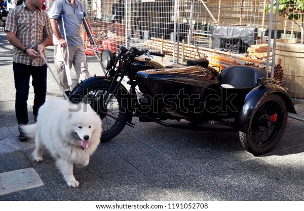 PERTH, AUSTRALIA - MAY 28 : Australian people\
joining with classic retro motorcycle and car festival for show\
people at garden park of St. John\'s Anglican Church on May 28, 2016\
in Perth, Australia