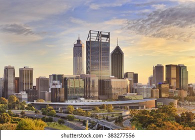 Perth city CBD towers close up view from lookout of Kings park at sunrise during gold sun light hour. 