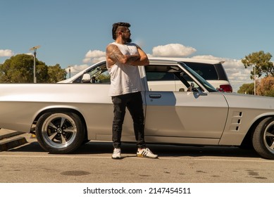 Perth, Western Australia - April 16th 2022: My Mechanic Friend Opening Up The Bonnet Of His Custom Made Car To Repair The Engine And Tightening Screws