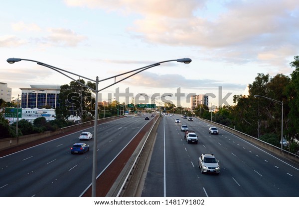 Perth, Western Australia, Australia. Aug 2019.\
Traffic streams along the motorway below the Hay Street bridge in ,\
Western Australia.