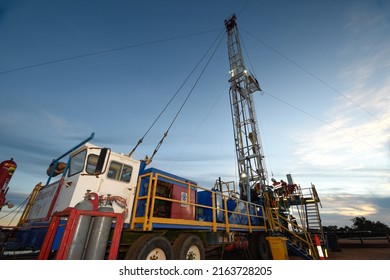 Perth, Western Australia, Aus Apr 1 2016 - A Small Onshore Drilling Rig At Dusk Works To Provide Gas For The City Of Perth.