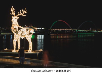 PERTH, WESTERN AUSTRALIA - December 25th, 2019: Christmas Lights And Sparkly Reindeer Sculpture At Night In Elizabeth QUay In The City Of Perth On Christmas Day