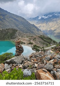 Peru, Cusco region, Humantay Lake. Smooth bright surface of a lake surrounded by mountains.