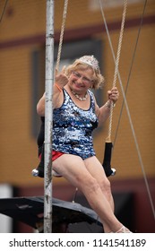 Peru, Indiana, USA - July 21, 2018 Older Woman Wearing  Circus Outfit On A Float Wearing A Beauty Crown At The Circus City Festival Parade