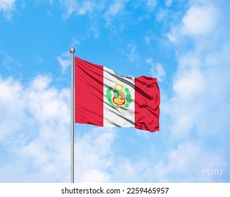 Peru  national flag flutters in the wind against a deep blue sky, in celebration of the founding of the republic. - Shutterstock ID 2259465957