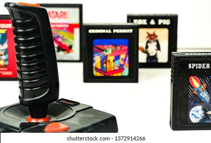 Perugia, Italy - 13 March, 2019: Atari Video Games Set: Joystick And A Few Cassettes (Spider Fighter, Fox & Pig, Criminal Persuit, Pole Position, Mario Bros)