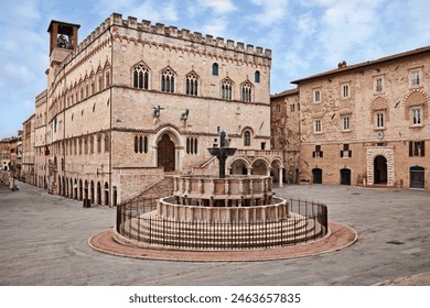 Perugia, Umbria, Italy: the main square with the fountain Fontana Maggiore, a masterpiece of medieval sculpture and monument symbol of the city. Behind the ancient Palazzo dei Priori in Gothic style

 - Powered by Shutterstock