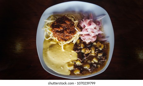 Peruvian culinary: chanfainita with tallarines, ceviche and salsa huancaina