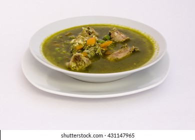 Peruvian Dish: Chicken soup of coriander (aguadito de pollo).