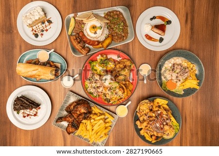 Peruvian Feast Spread with Ceviche, Roasted Chicken, Sandwiches, and Assorted Desserts, Overhead View 