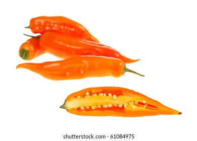 Peruvian Hot Pepper: An Aji Cut Half With Other Ajis In The Background Isolated On White (Selective Focus)