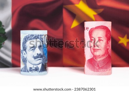 Peruvian Sol and Chinese Yuan Rolled Up on Background of Peruvian and China Flag.