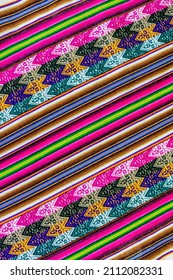 Peruvian traditional woven wool cloth background, Manta Lliclla