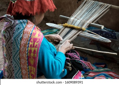 Peruvian Woman Weaving Cloth On A Hand Loom