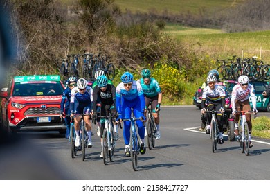 PESARO, ITALY - Mar 12, 2022: A Group Of Cyclists Traveling An Uphill Road On The Tirreno-Adriatico Road Cycling Stage Race