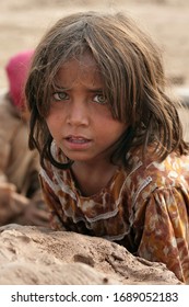 Peshawar, Pakistan, August 2007. A Young Afghan Refugee Works With Her Family In A Brick-making Camp