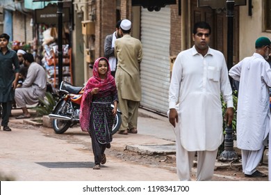 Peshawar, Pakistan - June 09, 2018: Young Pakistanian Girl In The Traditional Dress Walking On The Street