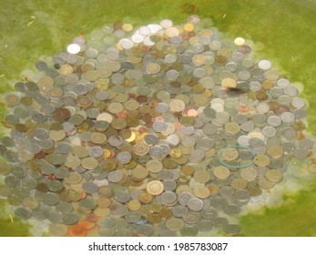 Peso Coins In Wishing Well