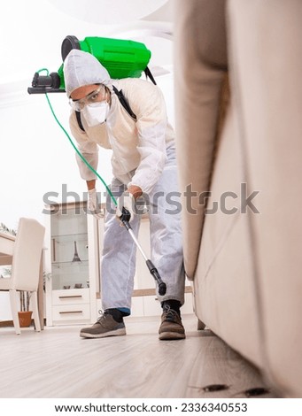 Pest control contractor working in the flat