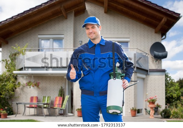 Pest\
Control Exterminator Man Worker In Front Of The\
Home