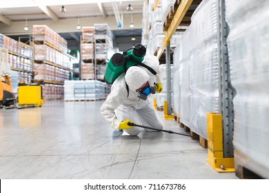 Pest Control Worker Hand Holding Sprayer For Spraying Pesticides in production or manufacturing factory - Shutterstock ID 711673786