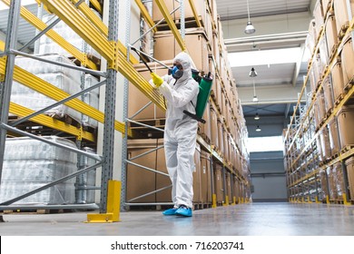 Pest Control Worker Hand Holding Sprayer For Spraying Pesticides in production or manufacturing factory - Shutterstock ID 716203741