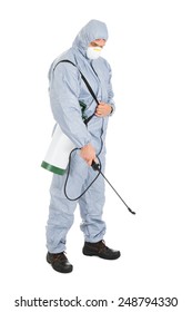 Pest Control Worker In Protective Workwear With Pesticides Sprayer Over White Background