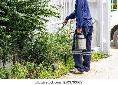 Pest control worker spraying insecticide, Termite extermination expert - Powered by Shutterstock