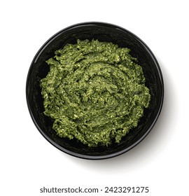 Pesto in black bowl isolated on white background, top view - Powered by Shutterstock