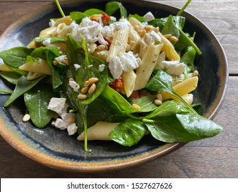 Pesto Pasta Salad Topped With Feta Cheese And Pine Nuts 