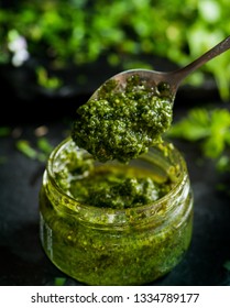 Pesto Sauce In A Spoon, Jar With Pesto Sauce