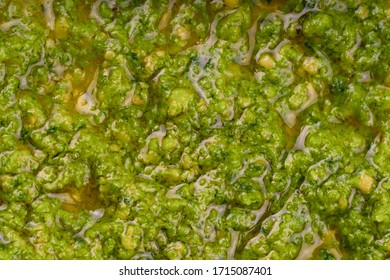 Pesto Sauce Texture From Basil, Garlic, Parmesan, Pine Nuts Or Seeds. Pesto All Genovese - Italian Cuisine, Dressing For Pasta. Spread Texture. Closeup, Top View