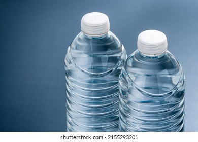 A PET bottle containing water. Black background. - Shutterstock ID 2155293201