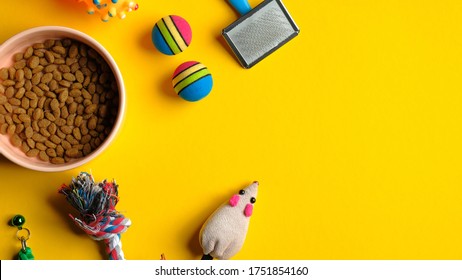 Pet care and training concept. Frame of grooming accessories for cat and dog on yellow background. Flat lay, top view. - Shutterstock ID 1751854160