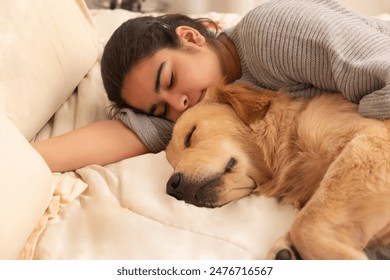 A PET DOG AND TEENAGER SLEEPING TOGETHER ON BED - Powered by Shutterstock