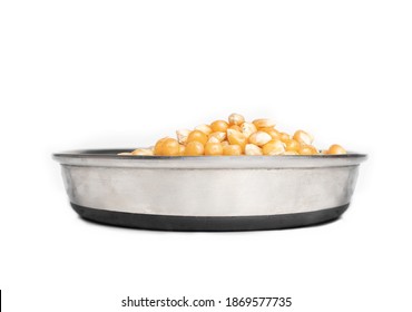 Pet Food Dish Filled With Corn Kernels, Perspective View. Concept For Too Much Corn Gluten Meal In Pet Food, Cats Don't Eat Corn In Nature Or Cats Are Carnivores. Isolated On White.