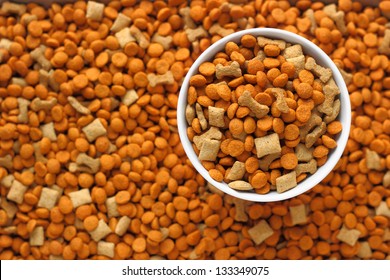 Pet Food In The Dog Dish With Background Of Pet Food Out Focus.