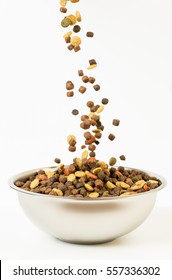 Pet Food Falls Into The Bowl For Feeding.