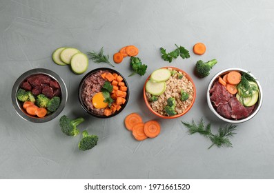 Pet Food And Natural Ingredients On Grey Table, Flat Lay