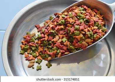 Pet Food In Scoop On Weighing Scale Tray