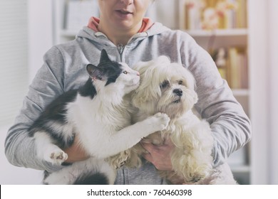 Pet Owner With Dog And Cat At Home