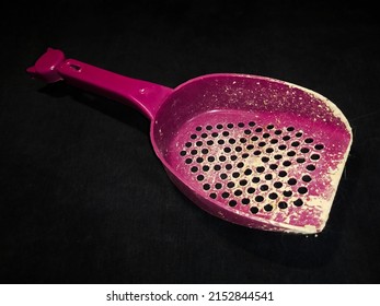 Pet Sand Shovel Isolated On A Black Background